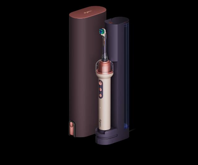 Dyson CameraJet toothbrush in the refill dock next to the travel case.
